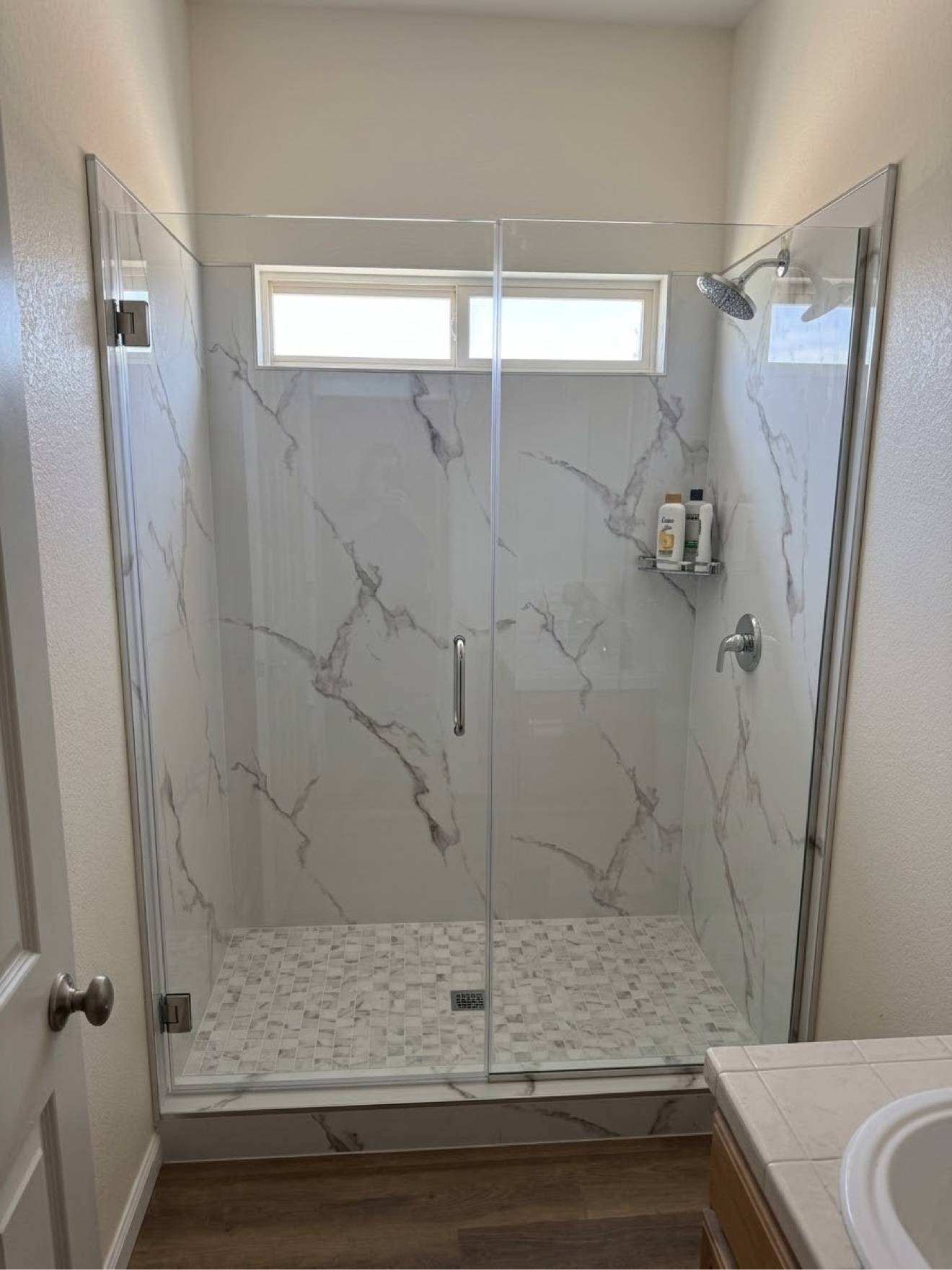 Finished walk-in shower with Pianello XL panels and frameless glass, Colorado Springs